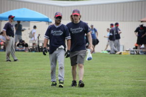 Ben Coiner escorts Luis Soto into the field against New Jersey